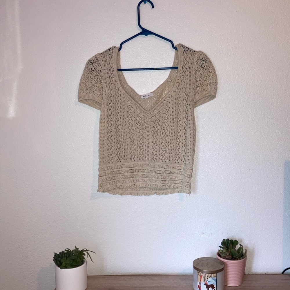 Short sleeve, v-neck, tan knit sweater. Size Large. Brand new never worn.